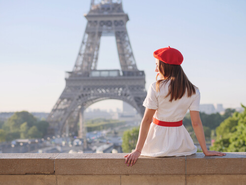 now you can book with halo flights and sit like the beautiful women looking at the Eiffel tower.